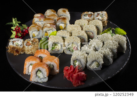 Seth sushi on a black background.Menu of the Japanese restaurant. Several sushi close-ups.A view of the rolls from above. A view of the rolls from above. Traditional Asian Food Seth sushi on a black background.Menu of the Japanese restaurant. Several sushi close-ups.A view of the rolls from above. A view of the rolls from above. Traditional Asian Food 120252349