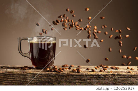Espresso in glass cup on a old wooden table. 120252917