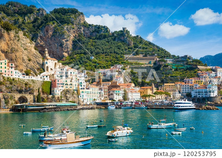 Beautiful Amalfi with hotels on hills leading down to coast, comfortable beaches and azure sea in Campania, Italy. Beautiful Amalfi with hotels on hills leading down to coast, comfortable beaches and azure sea in Campania, Italy. 120253795