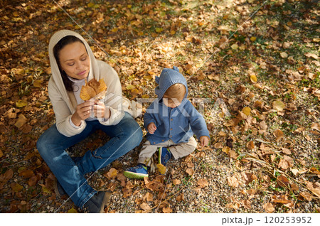 Mother and child enjoying a peaceful autumn day outdoors 120253952