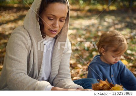 Mother and child enjoying a peaceful autumn day outdoors 120253969