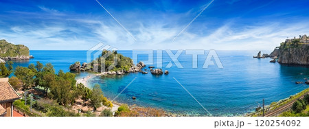 Isola Bella, small island near Taormina surrounded by azure waters of Ionian Sea, Sicily, Italy. Narrow path connects island to mainland Taormina beach. Isola Bella, small island near Taormina surrounded by azure waters of Ionian Sea, Sicily, Italy. Narrow path connects island to mainland Taormina beach. 120254092