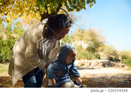 Mother and child enjoying a sunny autumn day outdoors 120254168