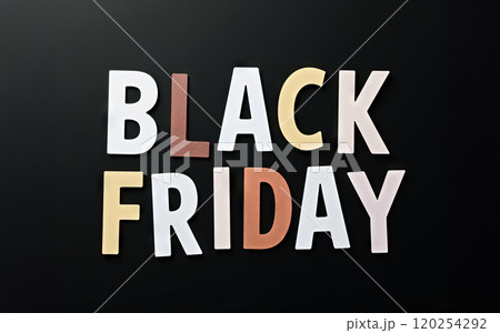 Black Friday words written on a black background. Time for promotions and sales in stores. 120254292