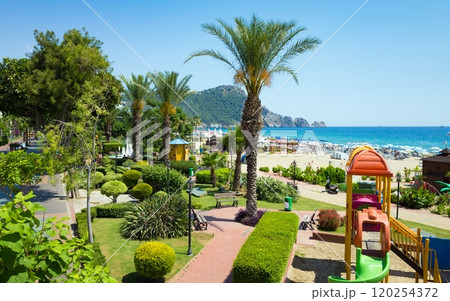 Beautiful green seafront, comfortable beach and clear blue sea in seaside resort city Alanya, Turkey. 120254372