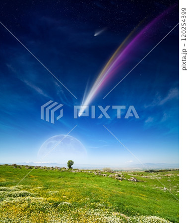 Amazing fantastic image: giant colorful comet and rising full moon in deep blue sky over green meadow Amazing fantastic image: giant colorful comet and rising full moon in deep blue sky over green meadow 120254399