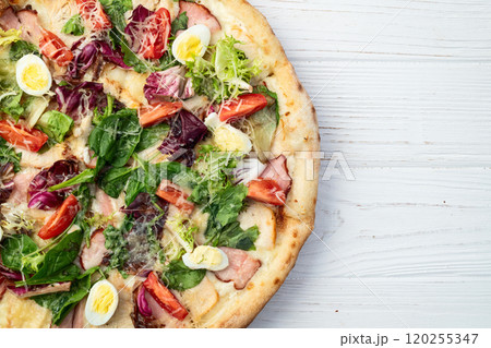 Italian pizza caesar with eggs salad chicken tomatoes and mozzarella photography. top view Italian pizza caesar with eggs salad chicken tomatoes and mozzarella photography. top view 120255347