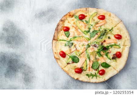 Italian pizza with avocado salmon tomatoes and mozzarella photography. top view Italian pizza with avocado salmon tomatoes and mozzarella photography. top view 120255354