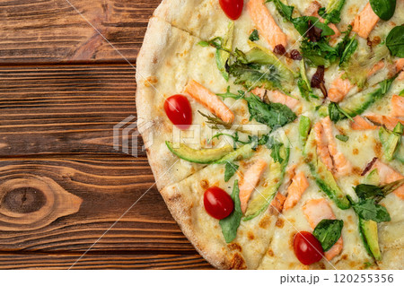 Italian pizza with avocado salmon tomatoes and mozzarella photography. top view Italian pizza with avocado salmon tomatoes and mozzarella photography. top view 120255356