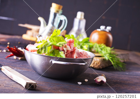 raw meat in metal bowl, meat and herb and spices 120257201