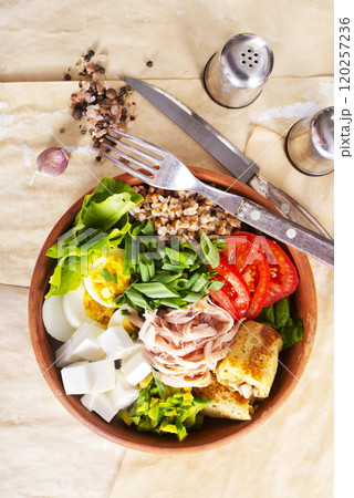 Delicious healthy breakfasts, buckwheat with boiled egg and meat and cheese 120257236