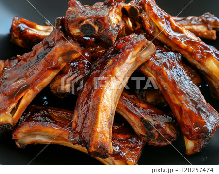 Close-up of glazed barbecue pork ribs with a rich, glossy sauce, highlighting savory 120257474