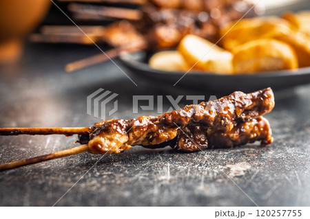 Japanese chicken yakitori on black table. 120257755