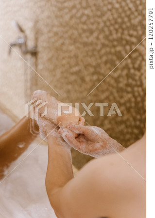 Luxurious foot spa experience with foamy bubbles for ultimate relaxation and rejuvenation 120257791