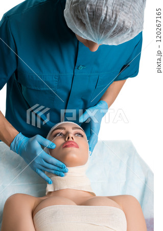 Plastic surgeon with his female pretty patient 120267165