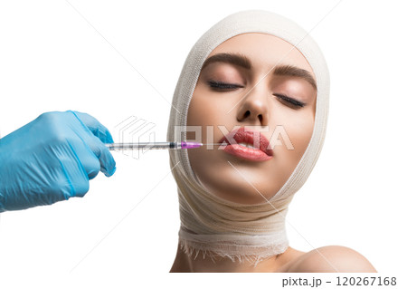 Girl her head bandaged getting lips injections 120267168