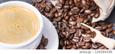 Coffee in white cup and roasted dark coffee beans Coffee in white cup and roasted dark coffee beans 120269190
