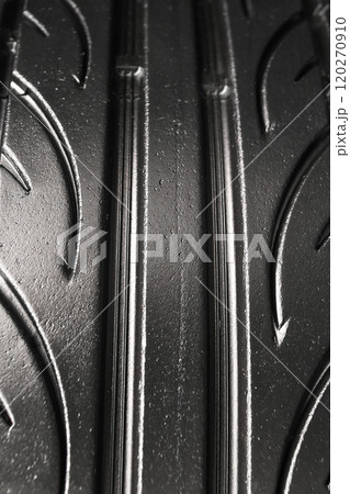 Close up of the tread surface of a used car tire 120270910