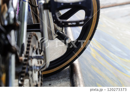 Close up of bmx bike on a ramp in a skatepark 120273373