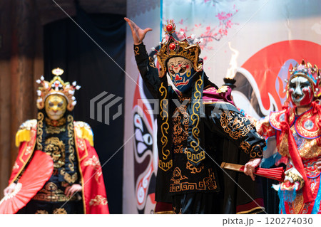 Chinese actor performs a public traditional changing face performance onstage in Chengdu, China 120274030