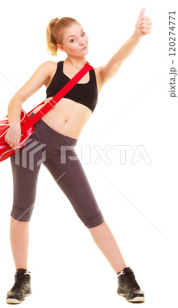Sport. Fitness girl with gym bag showing thumb up 120274771