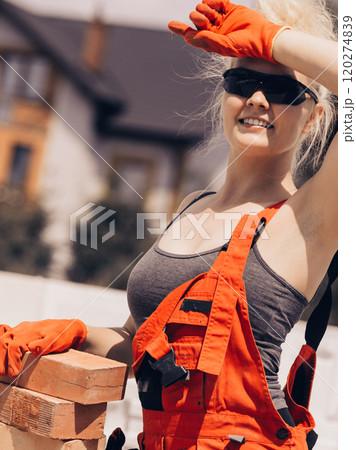 Woman working with bricks 120274839