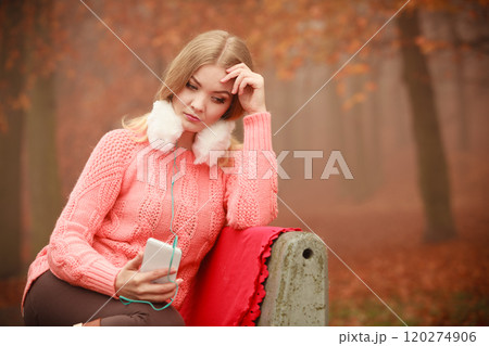 Smiling lady with headphones. 120274906