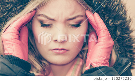 Woman suffering from headache pain. Cold. 120275230