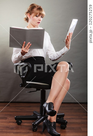 Woman learning with ebook and book. Education. Woman learning with ebook and book. Education. 120275259