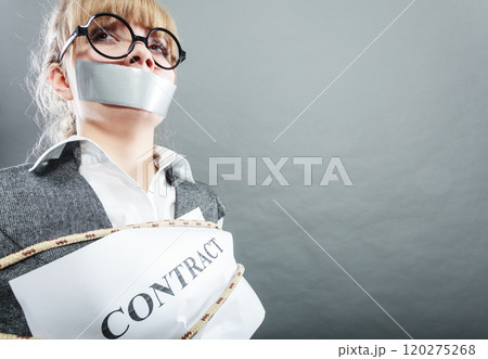 Afraid woman bound by contract with taped mouth. Afraid woman bound by contract with taped mouth. 120275268