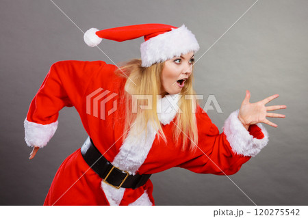 Happy woman wearing Santa Claus helper costume 120275542