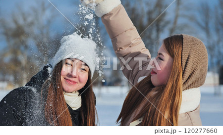 Schoolgirls get snowed in on a winter's day. Schoolgirls get snowed in on a winter's day. 120277660