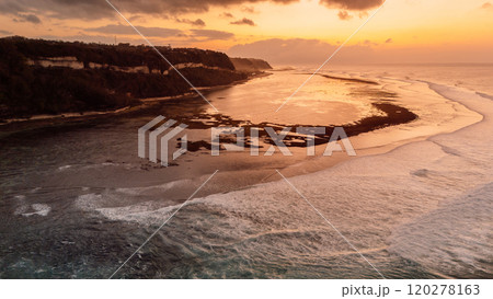 Coastline with waves on low tide and sunrise tones. Drone view 120278163