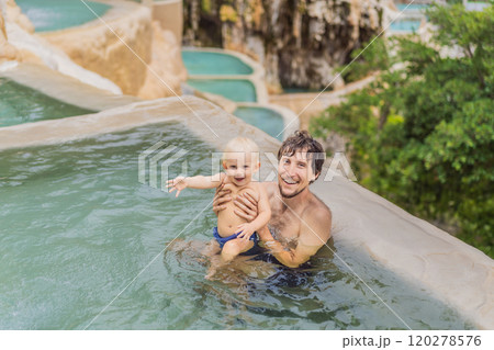Father with his toddler son bathing in the hot springs of Grutas Tolantongo, Mexico. Family adventure, relaxation, and natural wellness concept 120278576