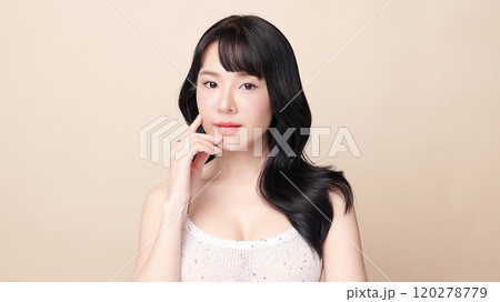 Beautiful young asian woman with clean fresh skin on beige background, Face care, Facial treatment, Cosmetology, beauty and spa, Asian women portrait. 120278779