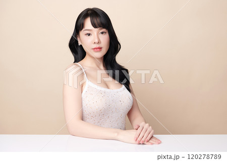 Beautiful young asian woman with clean fresh skin on beige background, Face care, Facial treatment, Cosmetology, beauty and spa, Asian women portrait. Beautiful young asian woman with clean fresh skin on beige background, Face care, Facial treatment, Cosmetology, beauty and spa, Asian women portrait. 120278789