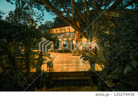 wooden cottage house at night wooden cottage house at night 120279436