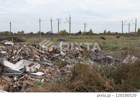 Construction waste. A pile of red broken bricks, concrete debris and rubble. Demolition rubble 120280520