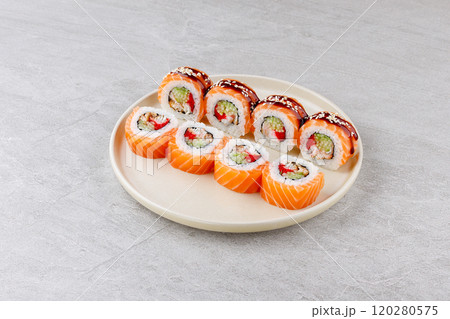 Japanese Sushi Rolls Philadelphia Uramaki Plate on Gray Background for Restaurant Menu or Food Delivery Japanese Sushi Rolls Philadelphia Uramaki Plate on Gray Background for Restaurant Menu or Food Delivery 120280575
