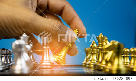 Concept, Image of confident hand of businessman moving chess pieces in competition for success in analysis of new strategic development plan. Leadership and teamwork concept for success. Concept, Image of confident hand of businessman moving chess pieces in competition for success in analysis of new strategic development plan. Leadership and teamwork concept for success. 120281897