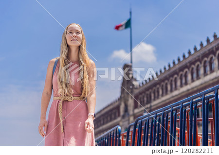 Female tourist in the central square of Mexico City, Zocalo. Cultural exploration, travel, and historic architecture concept 120282211