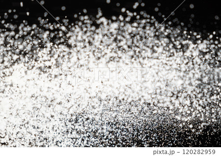 Abstract black and white background of pouring flour, space for text 120282959