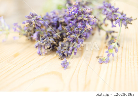 Bouquet of lavender flowers in Provence style on a wooden background, selective focus Bouquet of lavender flowers in Provence style on a wooden background, selective focus 120286868