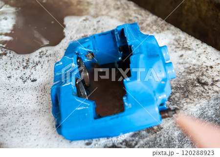 Checking car brake system for repair at car garage 120288923