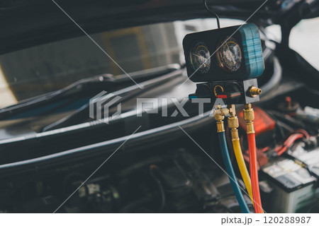 Car refilling air condition at car garage Car refilling air condition at car garage 120288987