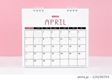 Desk calendar for April 2025 on a pink background with copy space. 120290703