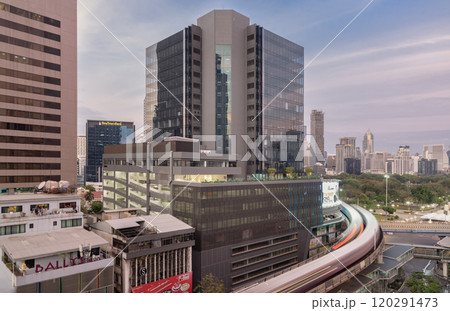BTS Sky railway tracks and Intersection bridge pass through in downtown with traffic on the street below in central business district. 120291473