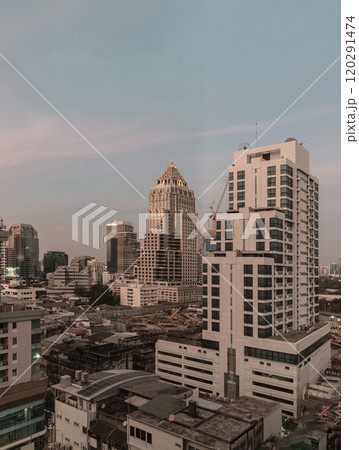 Architectural view of skyscrapers buildings in the central business district of Bangkok at evening. Architectural view of skyscrapers buildings in the central business district of Bangkok at evening. 120291474