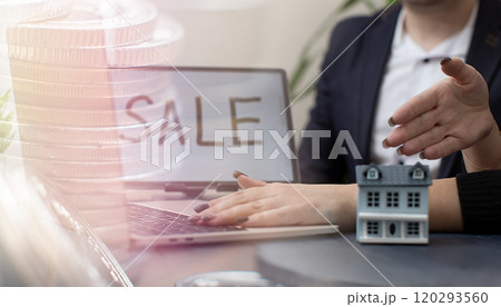Modern Real Estate Sale Concept with Miniature House and Laptop 120293560