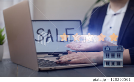 Modern Real Estate Sale Concept with Miniature House and Laptop Modern Real Estate Sale Concept with Miniature House and Laptop 120293561